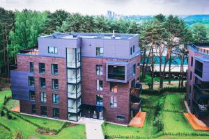 A new build block of flats surrounded by green space