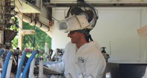 technician monitors chemical injection for environmental remediation