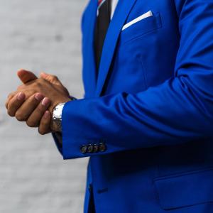 Man of color wearing a custom blue suit by Tylmen