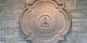 The DTS institutional seal produced in a stone mosaic in the administration building.