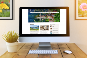 Computer with expatica website screen