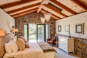 beautiful luxury bedroom in a stone-walled patio room