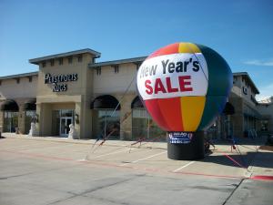 large multicolor advertising balloon on a roof