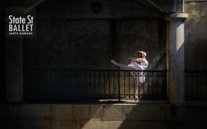 Ballet dancer in mask joyously dancing