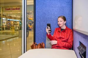 Woman in ZenSpace Pod at Westfield Valley Fair Mall Meeting Workspace Ondemand smart URW