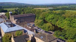 An Aerial photograph of Wealth Aspirations offices at Wharfebank Mills in Otley, England