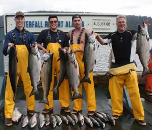 Dan Traub, Sam Traub, Nicholas Berardi and Craig Ode share their salmon catch at Waterfall Resort Alaska.