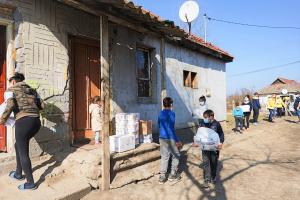  Children in Alex Galamb’s program take part in chaining supplies into his new bakery.