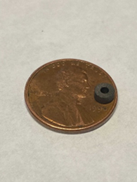 Graphalloy Miniature Bushing on a Penny for Semiconductor Manufacturing
