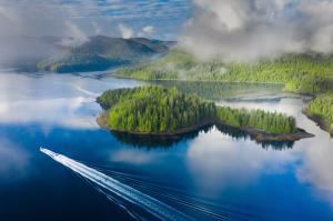 Waterfall Resort Alaska aerial of fishing boat and Alaska's beauty