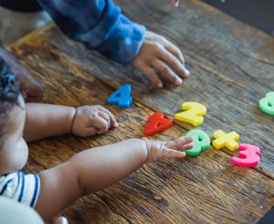 Young child with plastic toys