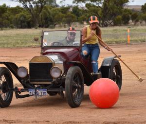 Two players in the World Autopolo Championships driving a Ford Model T racer