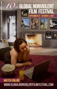 The poster of the 2021 edition of Global Nonviolent Film Festival features actress Kelly Dalston in front of a fireplace watching movies on her laptop.