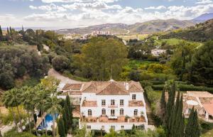 Located in the exclusive gated community of Puerto del Almendro, this French-inspired estate offers unparalleled privacy in the heart of Costa del Sol.