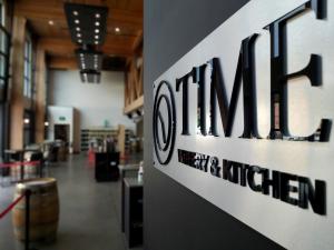 TIME Family Wines sign inside the winery's facility.