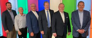 alt="Photo of new team together"