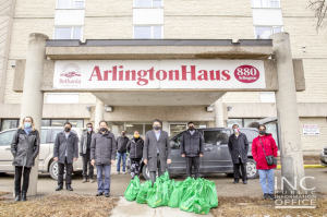 <img src="image3.png" alt="Group photo at Arlington Haus with volunteers from Iglesia Ni Cristo" />