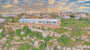 The exquisite views of the Mediterranean Sea are perfectly complemented in this contemporary oceanfront villa in peaceful Sa Torre.