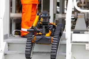Taurob Inspector robot climbing stairs on site (photo Total/Ben Mullay)
