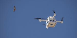 A Flirtey Eagle unmanned aircraft is shown in flight making a medical delivery