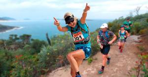 Trail Runners running across Fingal Head