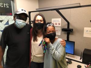 Boeing's ASL team at SignAll Lab: three smiling people in masks