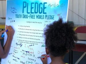 Children pledge to live drug-free and to help their families and friends make the same commitment.