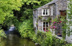 Old English cottage on river
