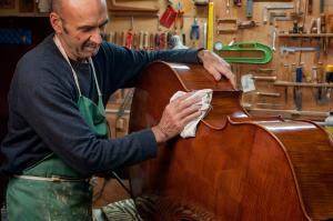 Luthier fixing guitar