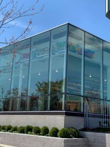 Close up of test art hung in the NE corner windows of the project location at Baldwin Public Library in Birmingham, MI a community in Metro Detroit.