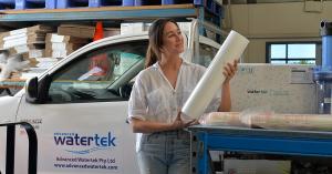 Woman holds polypropylene water filter cartridge