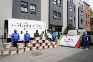 <img src="ottawa 1.jpg” alt=“Ministers and members of Iglesia Ni Cristo church stand with Sandra Auger from homeless shelter La Maison du Père in Quebec, Canada after the church had dropped off a portion of the ten thousand pounds in donations” />