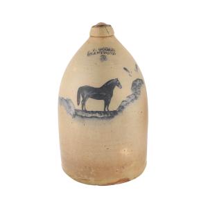 Rare 1870s three-gallon jug by F. P. Goold, featuring a race horse decoration in cobalt slip (est. CA$8,000-$12,000).