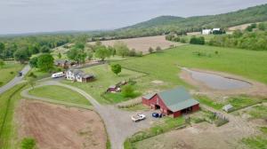Move-in ready 4 BR/2.5 BA tri-level home on 20.46± acres -- 3,200± sf. -- 2 story 88'x50' barn -- 12'x16' shed w/8' shed off -- Entire property is board fenced w/2 cross fences -- Spring fed pond -- Property is in a conservation easement!