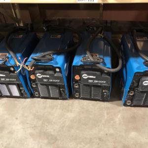 A row of refurbished Miller XMT 350 Multiprocess Welders repaired by the production team at GES. Available for rent or direct buy.