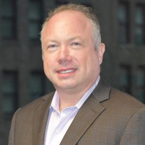 Photo show a man in business casual clothing, head and shoulders image.