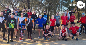 group of man and woman in a forest with running clothes