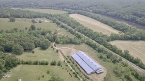 Bluebird Hill Farm is a 102.77± ac Albemarle County farm with a 3 bedroom 2 bath brick home, 2 high quality barns w/offices, equestrian center/arena w/office & living quarters, pastures, paddocks & fencing, 6 wells & multiple waterers and frontage on the James River