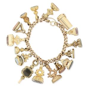 Victorian intaglio seal charm bracelet, 9kt to 18kt gold, with 16 charms, including a 9kt gold cigarette holder and a pocket watch key (CA$4,425).