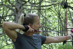 Women bow and arrow at full draw