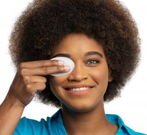 young woman showing how easy it is to use EverTears® on her eye to help dry eye symptoms and meibomian gland dysfunction (MGD)