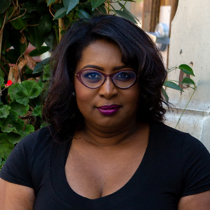 woman wearing black top and glasses