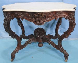 Rosewood rococo marble-top center parlor table attributed to Alexander Roux. Estimate: $2,500-$5,000.