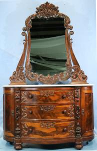 Rosewood heavily carved marble-top dresser attributed to Mitchell & Rammelsberg, premium-grade, 88 ½ inches tall. Estimate: $2,000-$3,000.