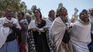 Women mourn after massacre in Dengolat, Tigray, February, 2021