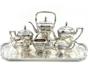 Reed and Barton sterling tea service with matching sterling silver tray, pattern 910, having a kettle on a stand, 287 oz. troy. Estimate: $4,000-$6,000.