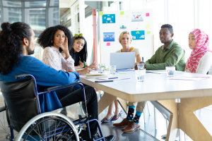 Diverse managers around a conference table.