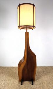 Rare George Nakashima live edge walnut floor lamp on a trestle base, 61 inches tall by 16 inches wide. Estimate: $5,000-$8,000.