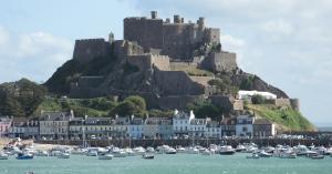Mont Orgueil is a castle in Jersey, Channel Islands, that overlooks the harbour of Gorey, also called Gorey Castle by English-speakers and lé Vièr Châté or the Old Castle by Jèrriais-speakers.
