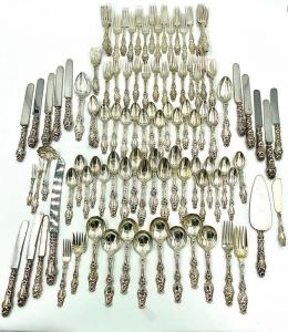 Whiting sterling flatware service in the Lily pattern, 112 pieces, with various monograms on most pieces, weighing a total of 129.90 oz. troy ($9,225).